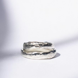two white gold wedding rings on a white background